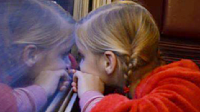 PolarExpresslookingoutwindow Kids enjoying a ride in the The Polar Express, a two-hour, round-trip ride reminiscent of the beloved children’s tale.