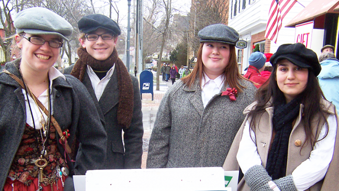 chestuntssignanddickenscharacters Downtown Skaneateles transforms into a Victorian village, thanks in part to the 50 costumed characters interpreting Dicken’s A Christmas Carol.