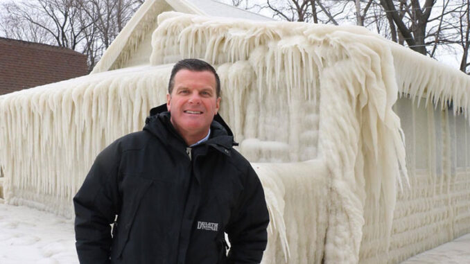 John Kucko stands by a frozen building in Webster near Lake Ontario. Courtesy of John Kucko.